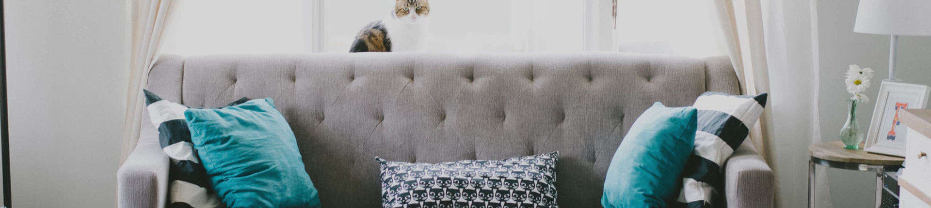 Fix and Flip Loans California - grey couch with teal cushions